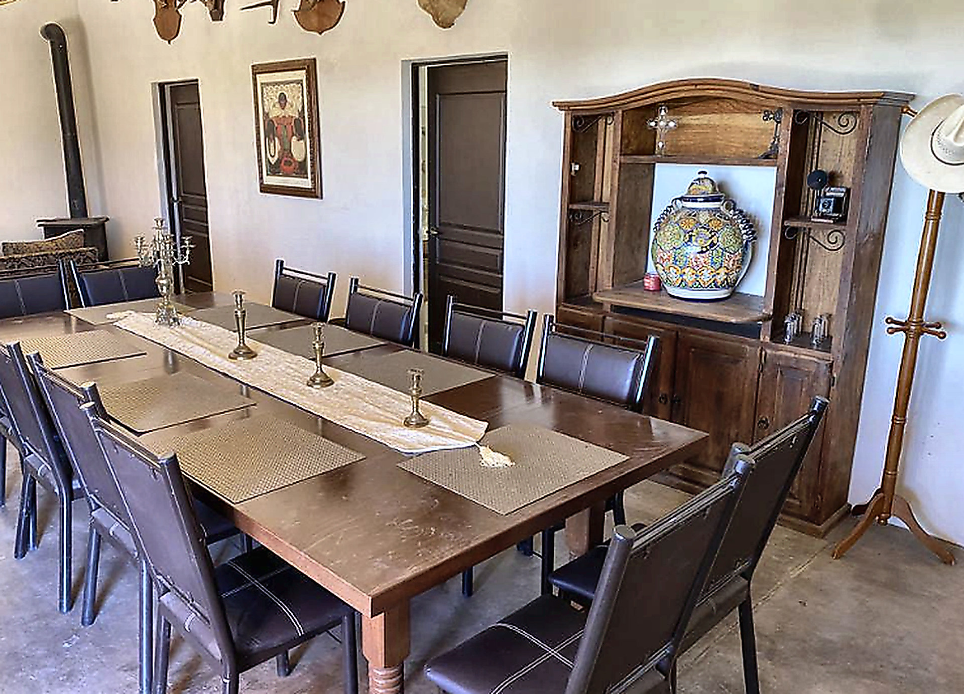 Long dining table set for hunters inside the Sonora ranch lodge